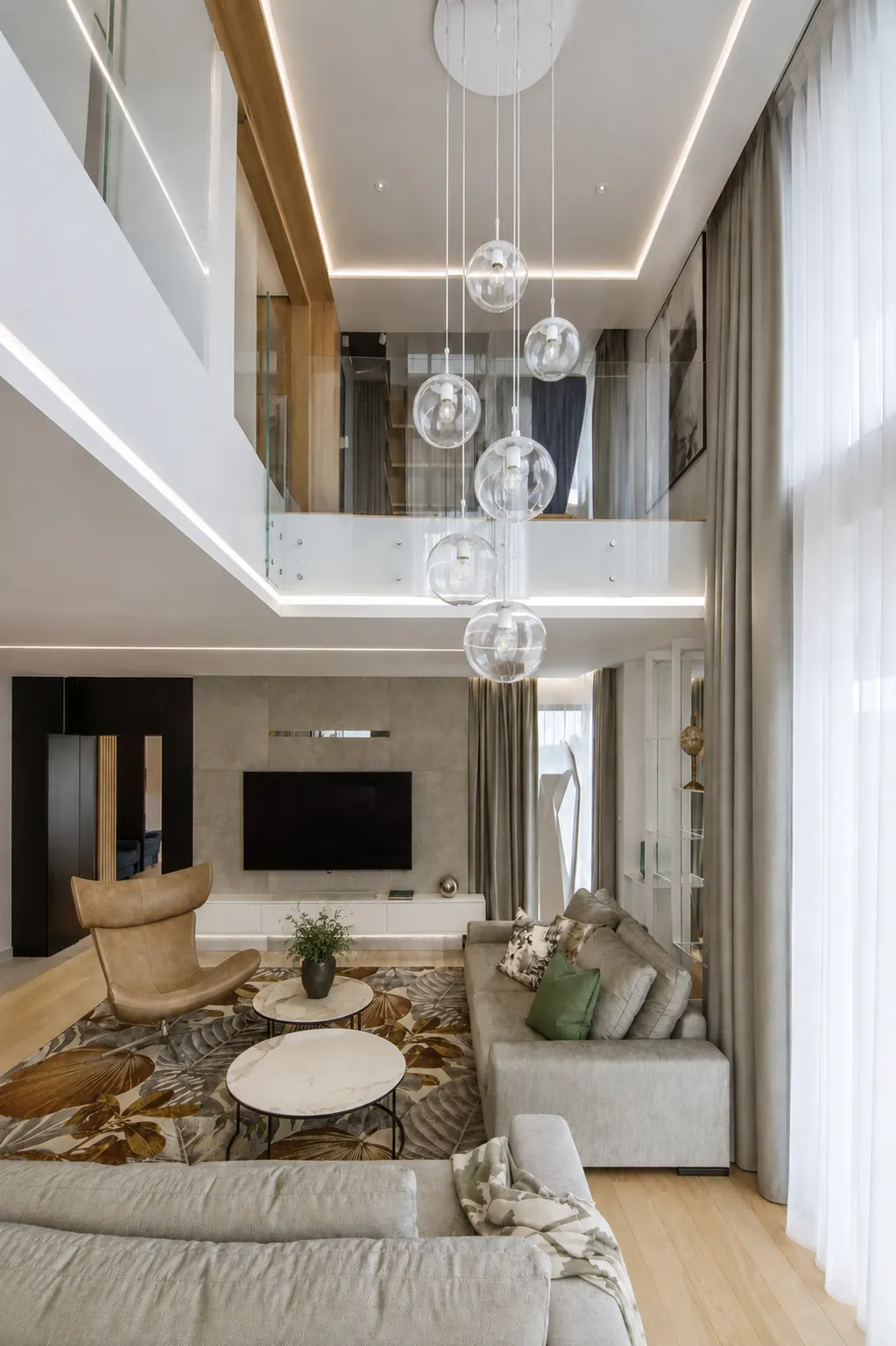 Rooms with high ceilings require more than just a sufficiently large light fixture.